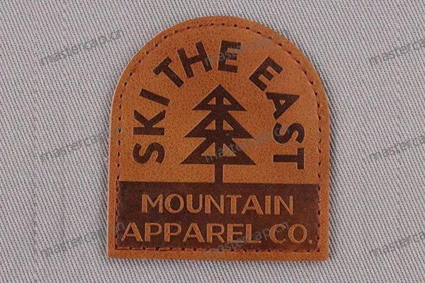 ML002 Top-grain leather patch with brown debossing (sew-on)