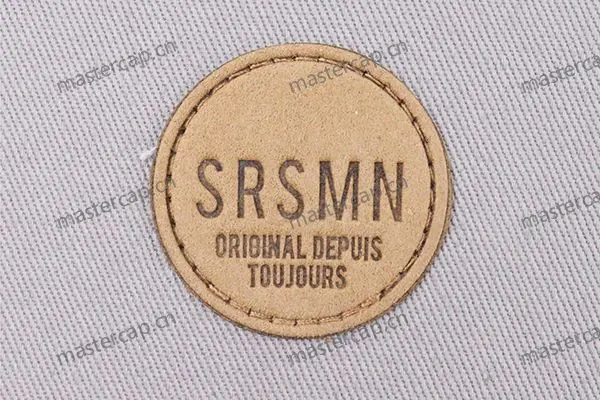 ML007 Microfiber suede patch with dark-brown debossing (sew-on)