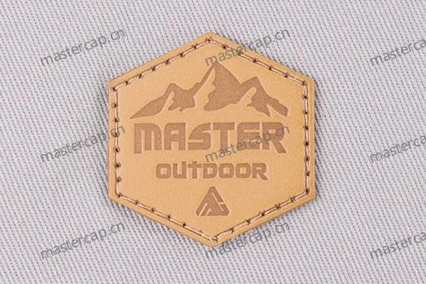 ML009 Split-leather patch with brown debossing (sew-on)