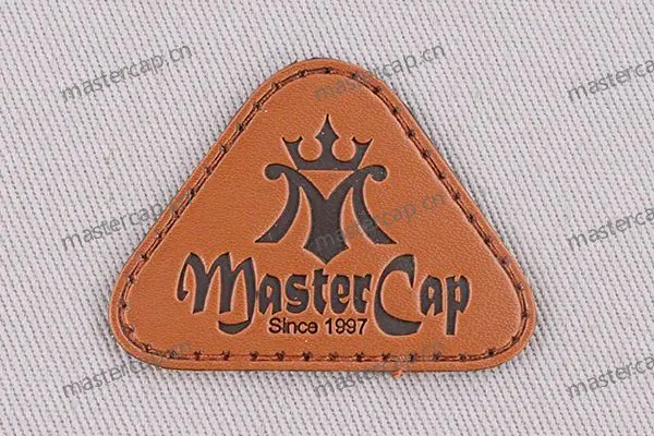 ML010 Split-leather patch with dark-brown debossing (sew-on)