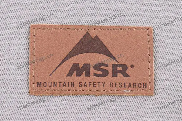 ML012 Split-leather patch with dark-brown debossing (sew-on)