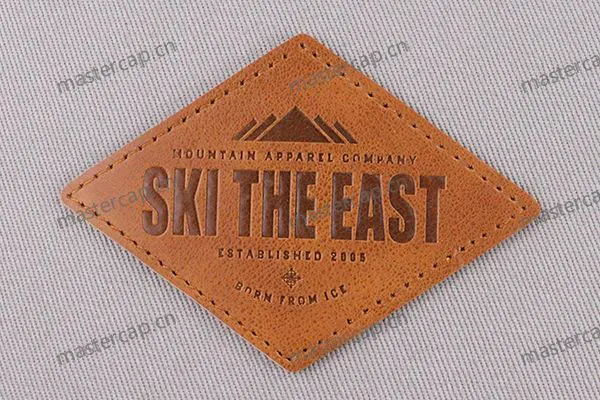ML019 Split-leather patch with dark-brown debossing (sew-on)