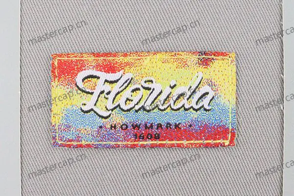 MW007 Woven patch applique secured with running stitches