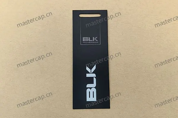 MHT010 600 gsm matte-laminated, double-sided printed art-paper hangtag with spot UV and clear plastic J-hook