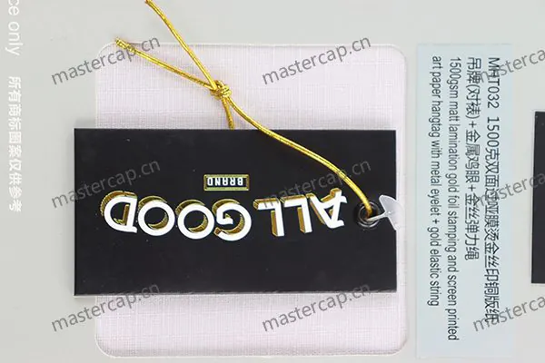 MHT032 150 gsm matte-laminated art-paper hangtag with gold foil, screen printing, metal eyelet and gold elastic string