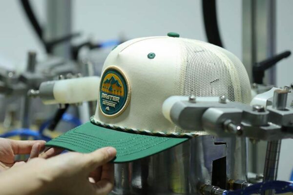 Cap ironing and shaping process