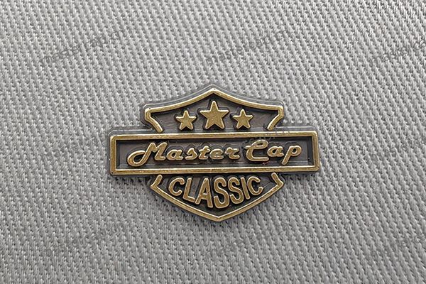 Special metal decoration process for custom caps