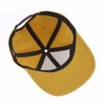 Foam-backed golf cap interior with stretch sweatband and branded seam tape