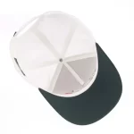 Golf performance cap interior with stretch sweatband and branded seam tape