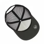 Interior of 5-panel trucker cap with under-visor rubber badge