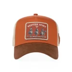 Rust-brown 5-panel trucker cap with woven western patch, front view