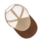 Five-panel trucker cap interior with mesh back and faux-suede visor