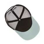 Five-panel trucker cap interior with mesh back and curved visor
