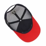 Six-panel trucker cap interior with navy mesh and curved visor