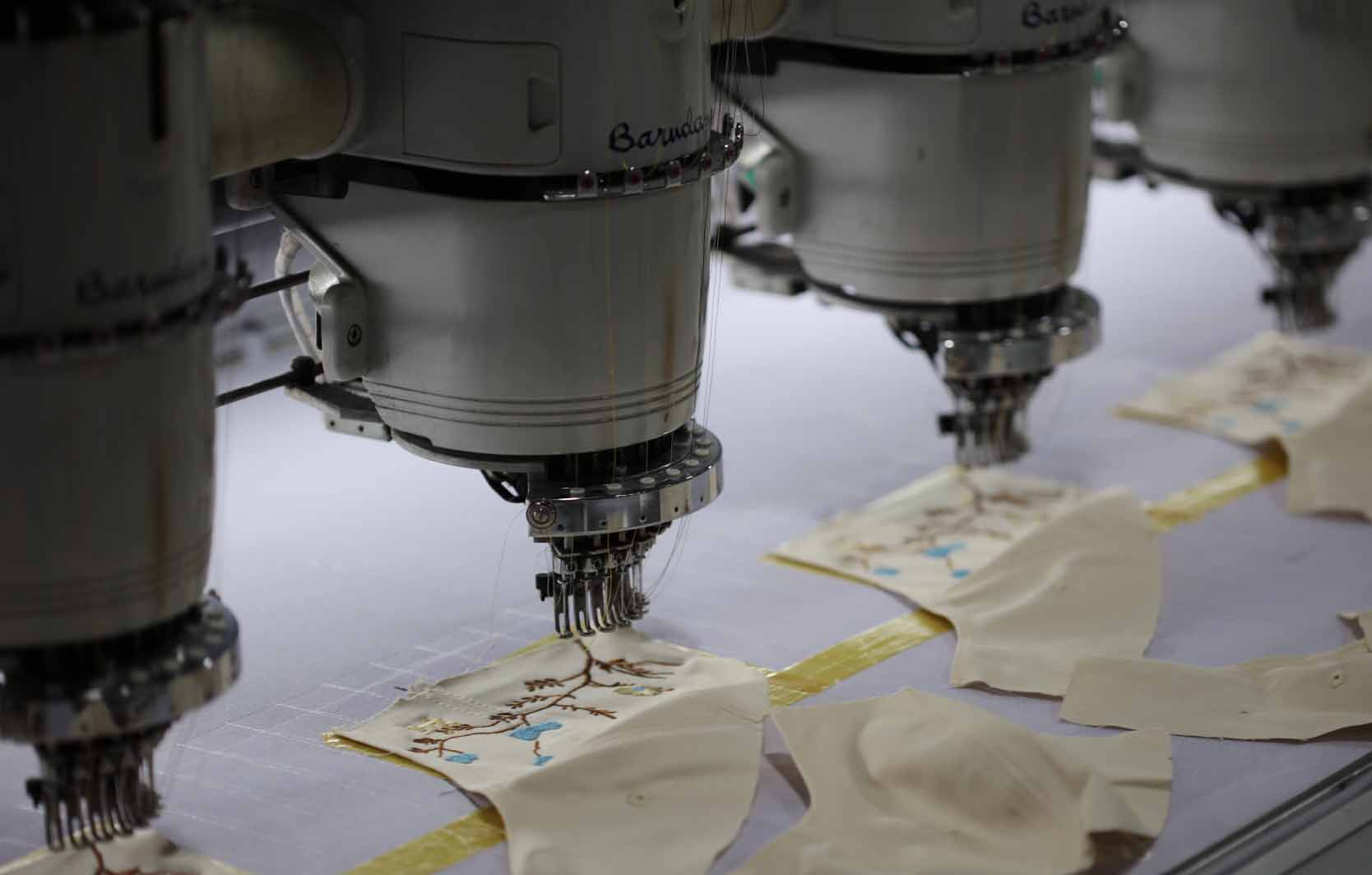 Multi-head embroidery machines producing custom cap panels at MasterCap