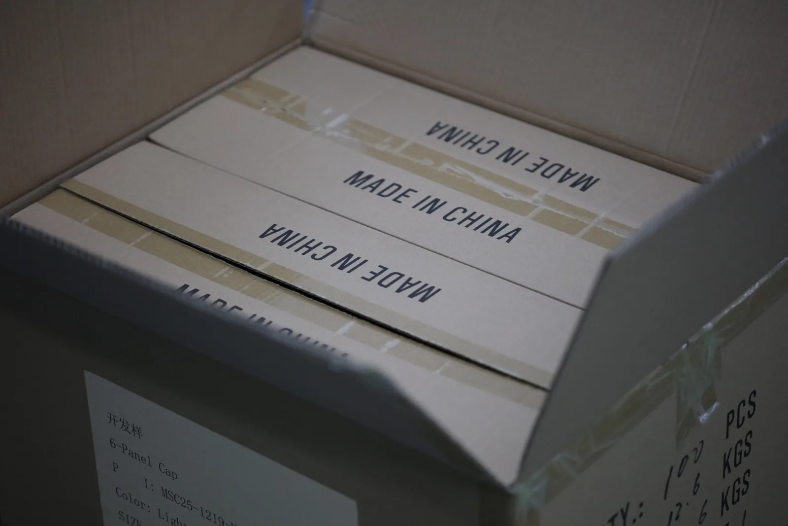 Custom headwear packed in inner boxes inside an export carton
