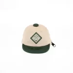 Alternate front view of beige and dark-green mini cap bag keychain