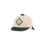 Alternate front-angle view of beige and dark-green mini cap bag keychain