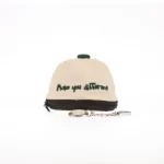 Rear view of mini cap bag showing zipper and flat embroidery