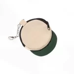 Top detail of beige and dark-green miniature cap-shaped zipper pouch