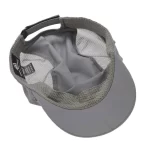 Interior of outdoor cap showing mesh panels, sweatband and rear adjuster