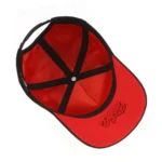 Interior view of black cap with red lining and embroidered red under-visor