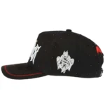 Left-side view of black structured cap with white embroidery and crown rhinestones