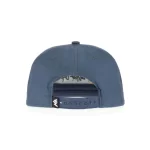 Rear view of 5-panel cap with seven-hole snapback and woven label